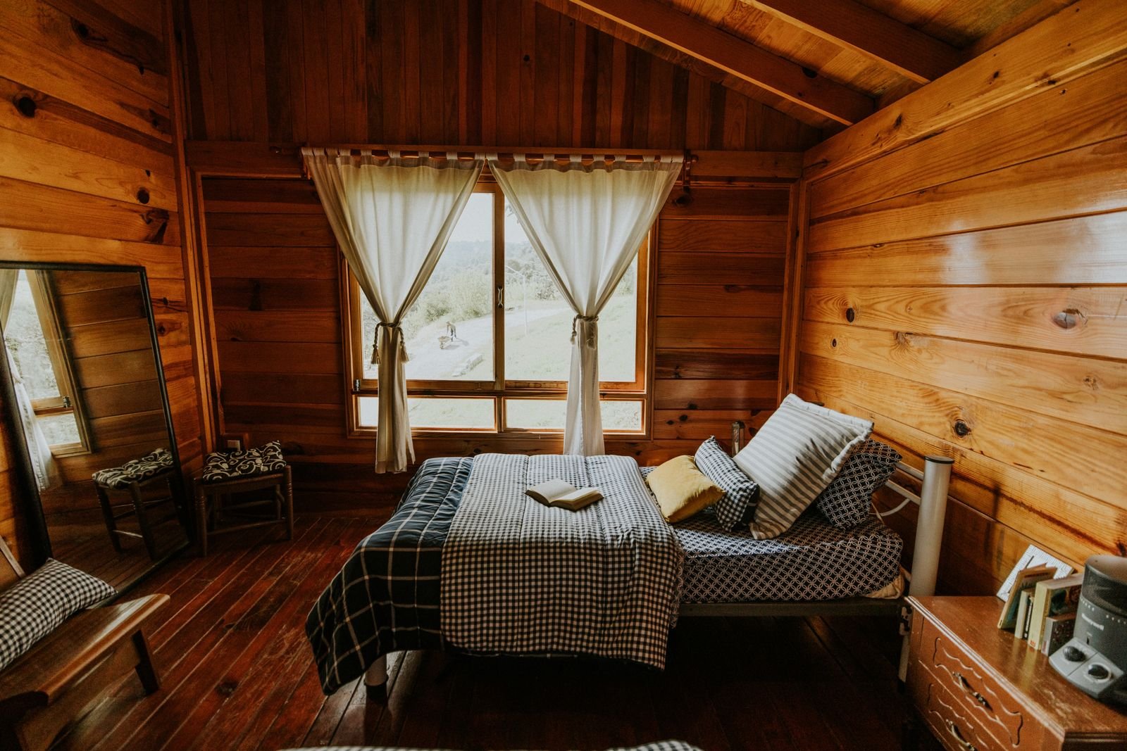 Wooden cottage bedroom with a view of nature